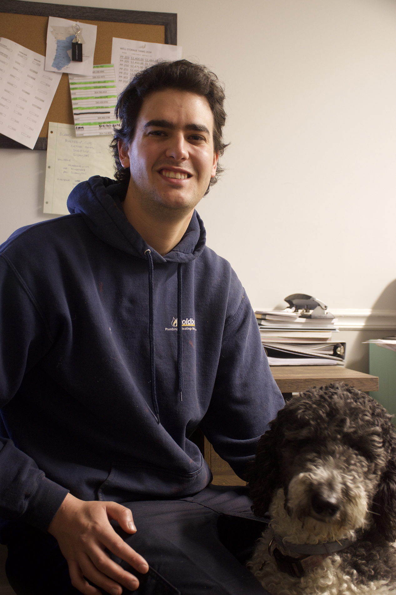 heating services goldberg plumber with the office dog